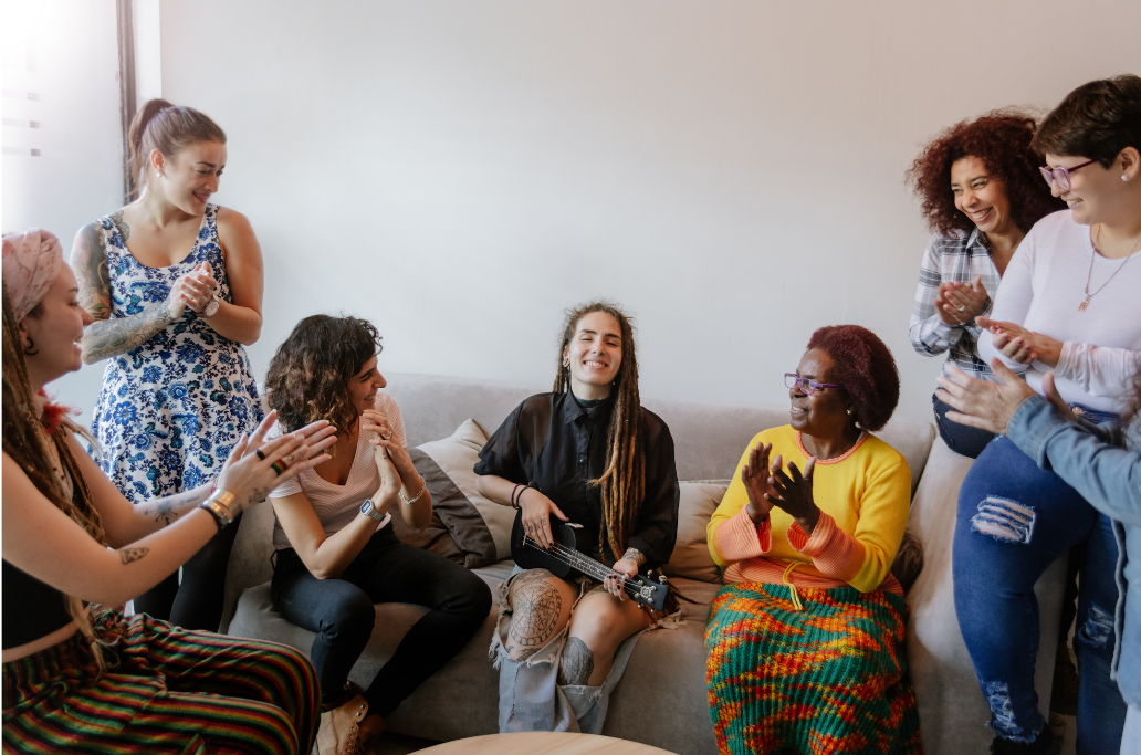 group of diverse individuals having a conversation in a room